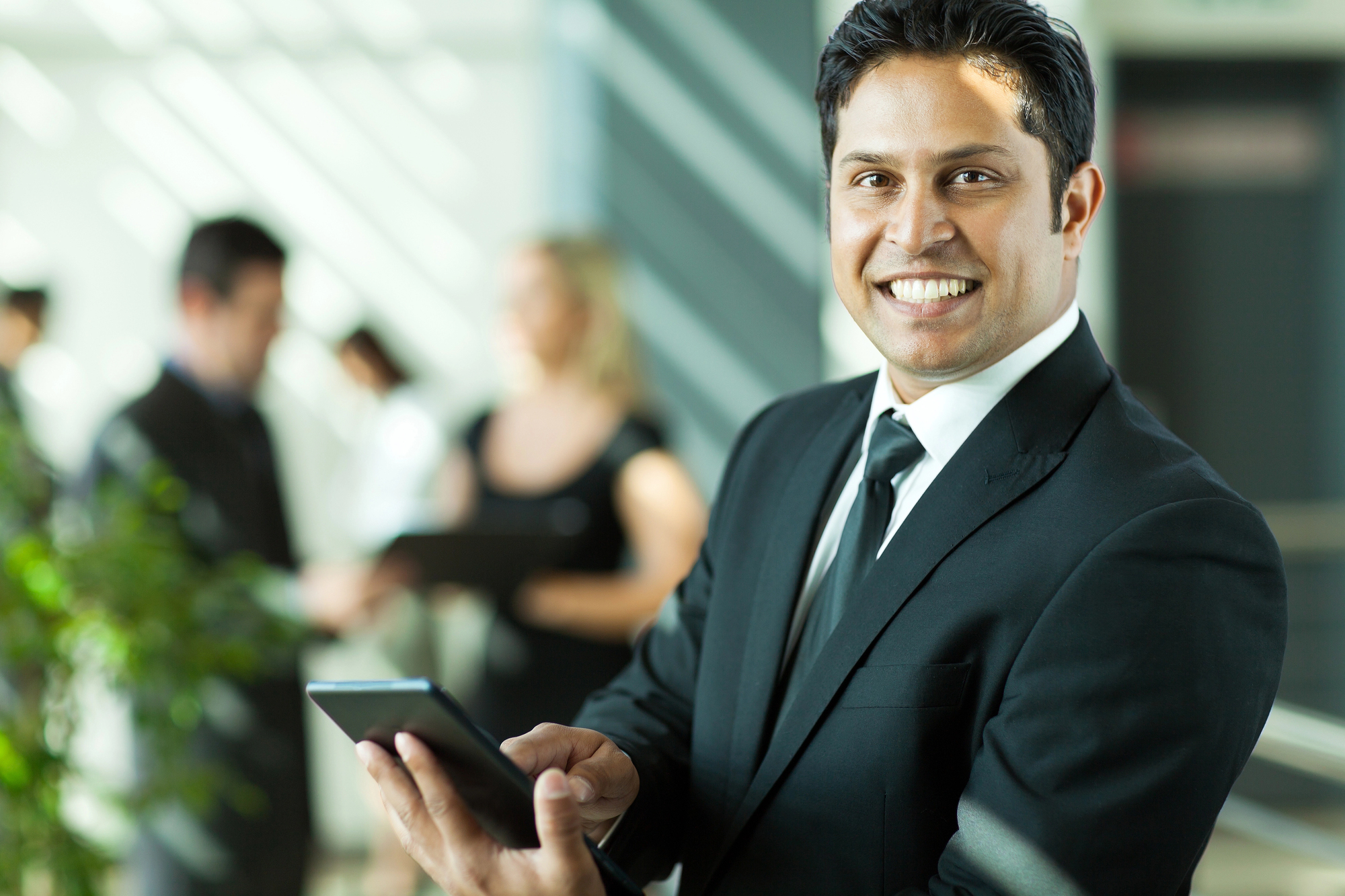 A professional holding a tablet